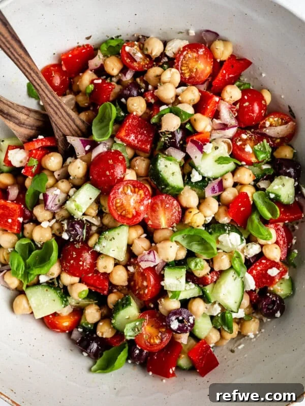 Mediterranean Chickpea Salad tossed in a bowl