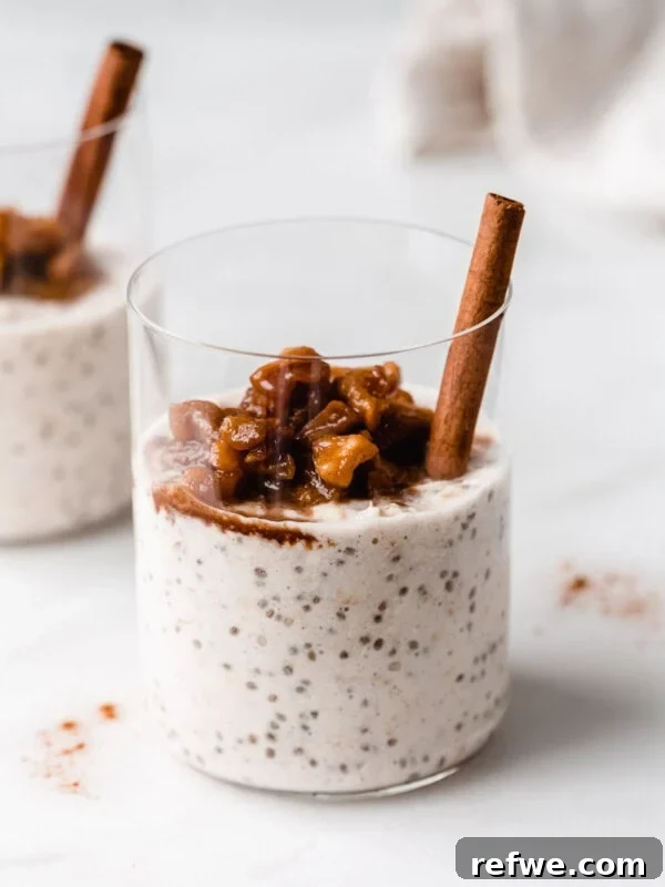 a cup of apple overnight oats topped with stewed apples