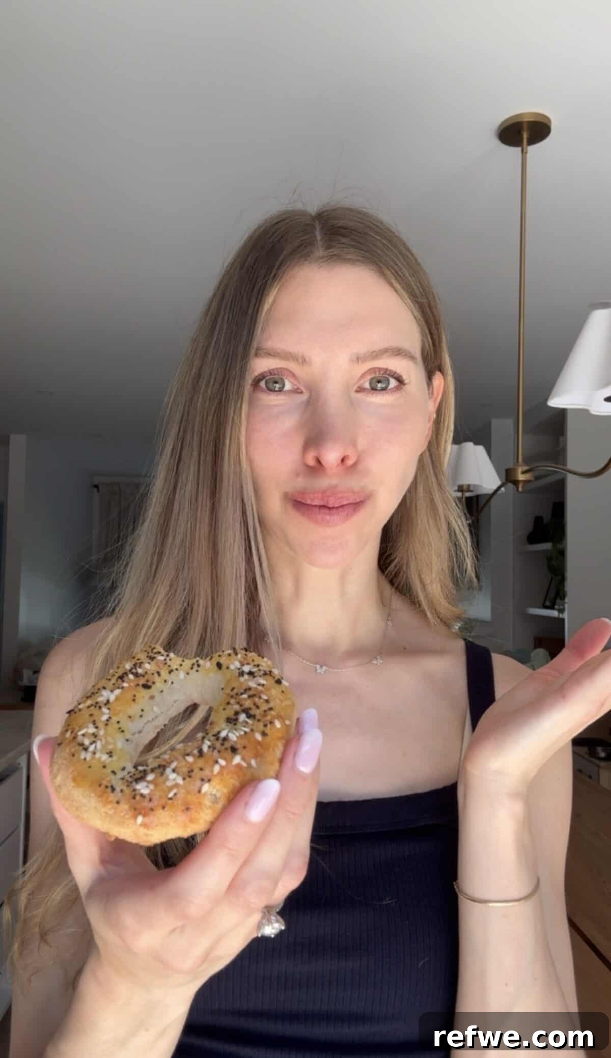 Cottage Cheese and Almond Flour Bagel Recipe 3 Girl eating a cottage cheese almond flour bagel.