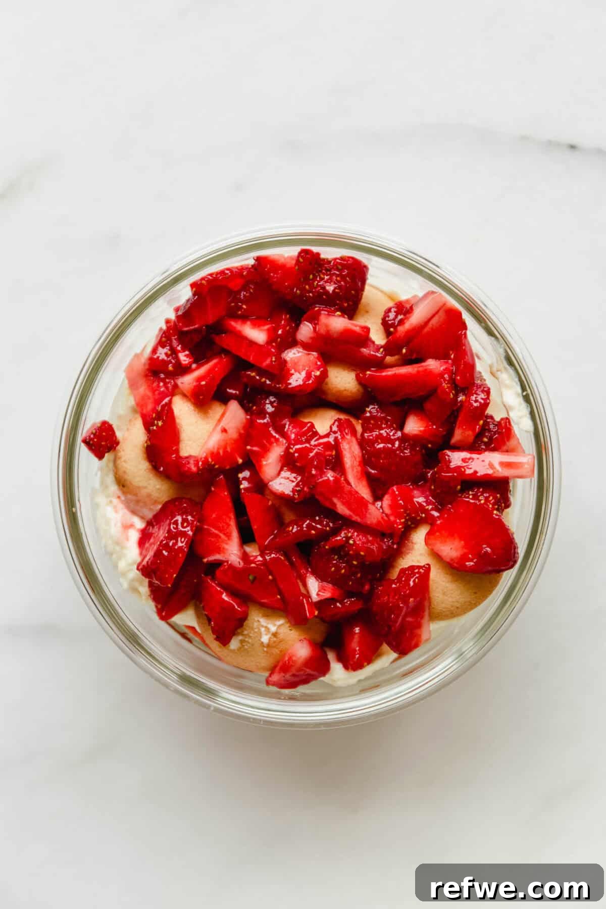 Mini Strawberry Cheesecake Pudding Jars 7 chopped strawberries layered on nilla wafers and greek yogurt pudding mix.