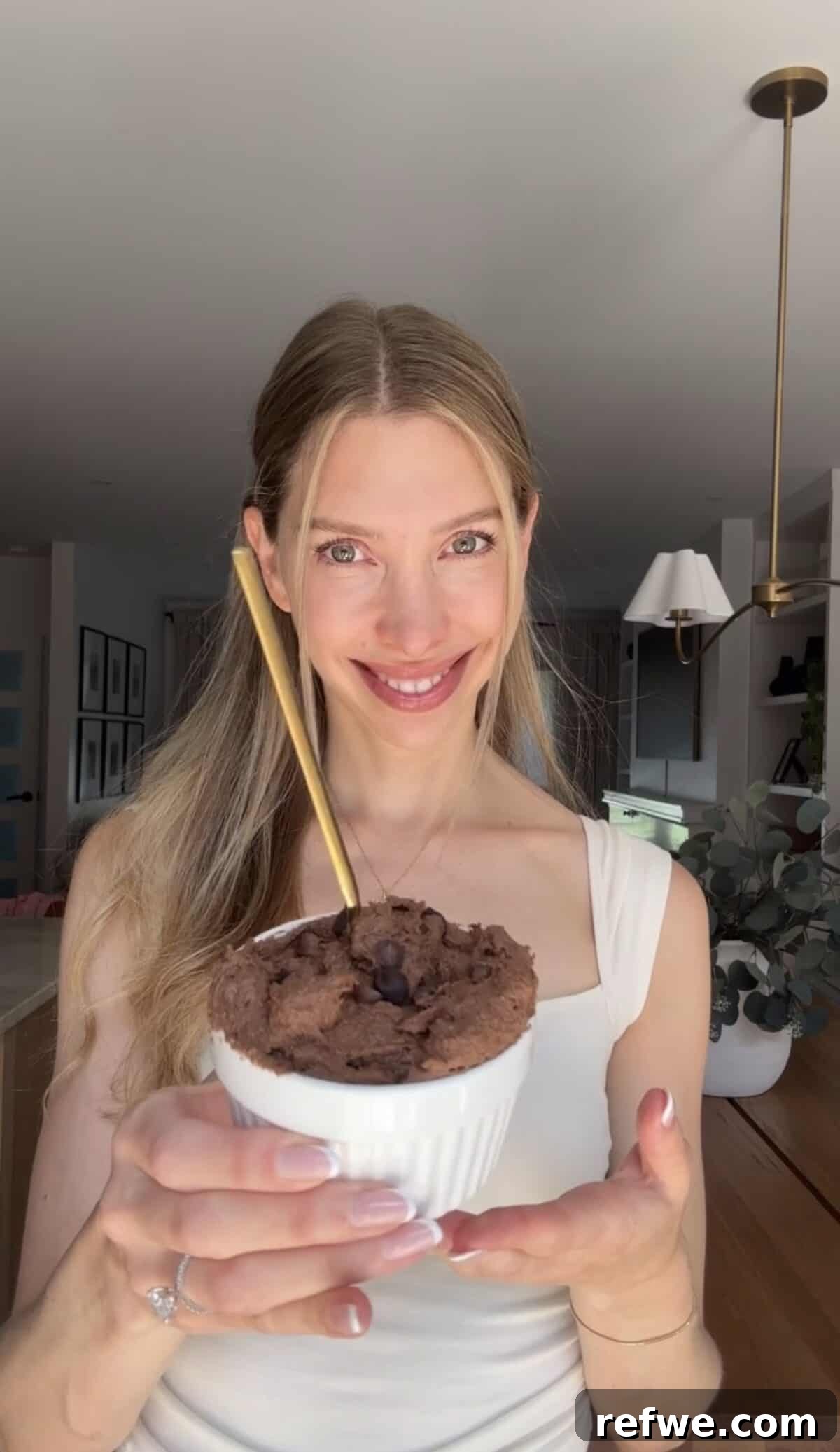 Cottage Cheese Brownie Batter Recipe 3 Jess from Choosing Chia holding cottage cheese brownie batter.