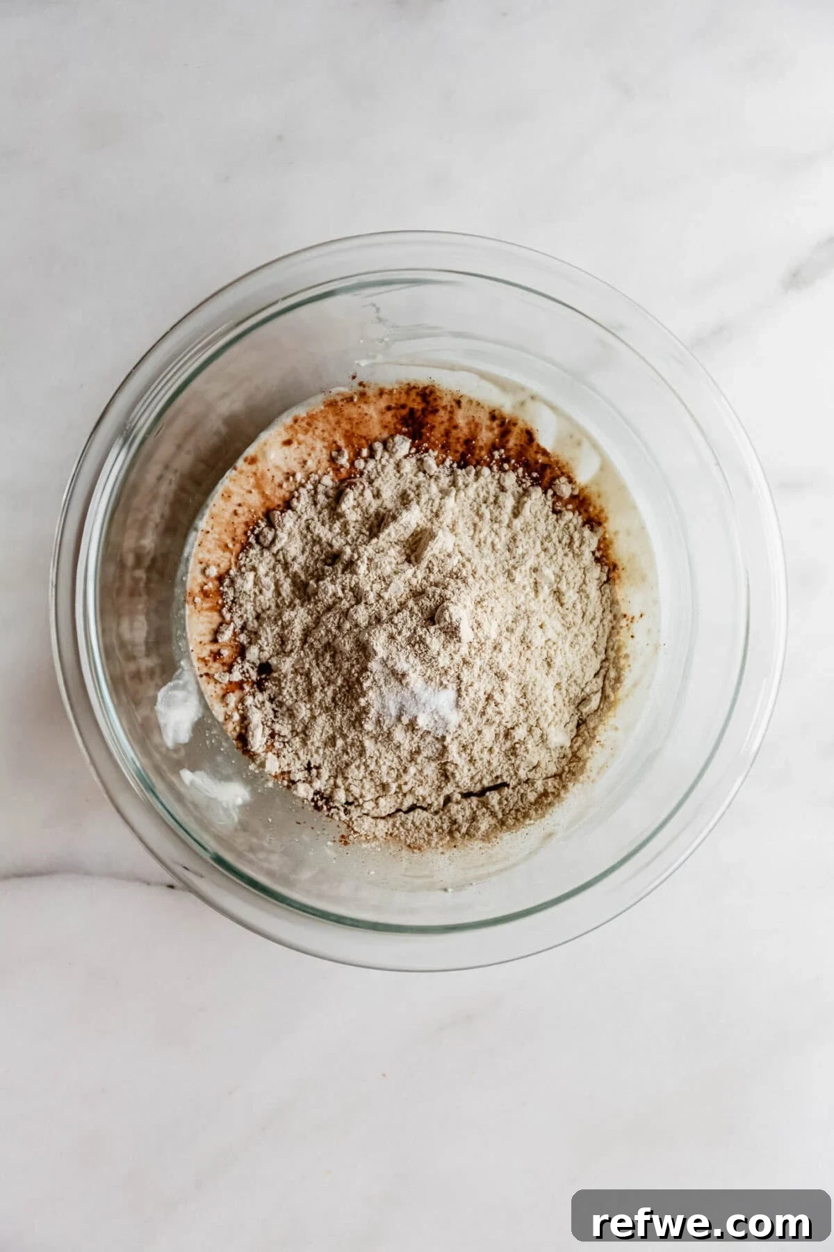 Cottage Cheese Brownie Batter Recipe 7 oat four in a bowl with blended cottage cheese.