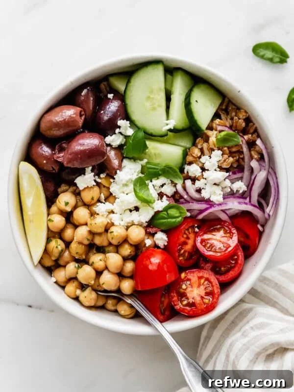 Bang Bang Chicken Bowl Recipe with Spicy Cucumber Salad 15 A greek power bowl with chickpeas, cherry tomatoes, olives and cucumber