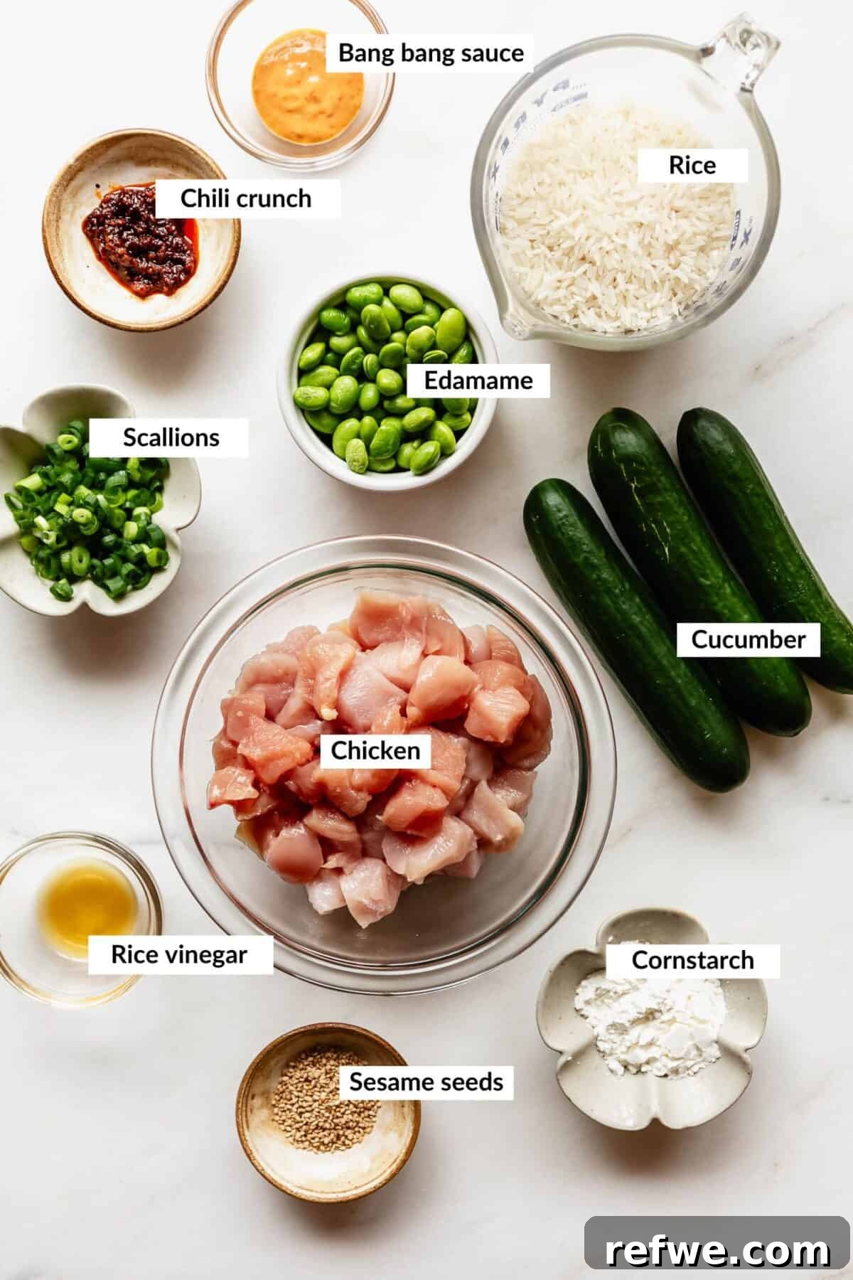 Bang Bang Chicken Bowl Recipe with Spicy Cucumber Salad 3 Ingredients for bang bang chicken bowls.