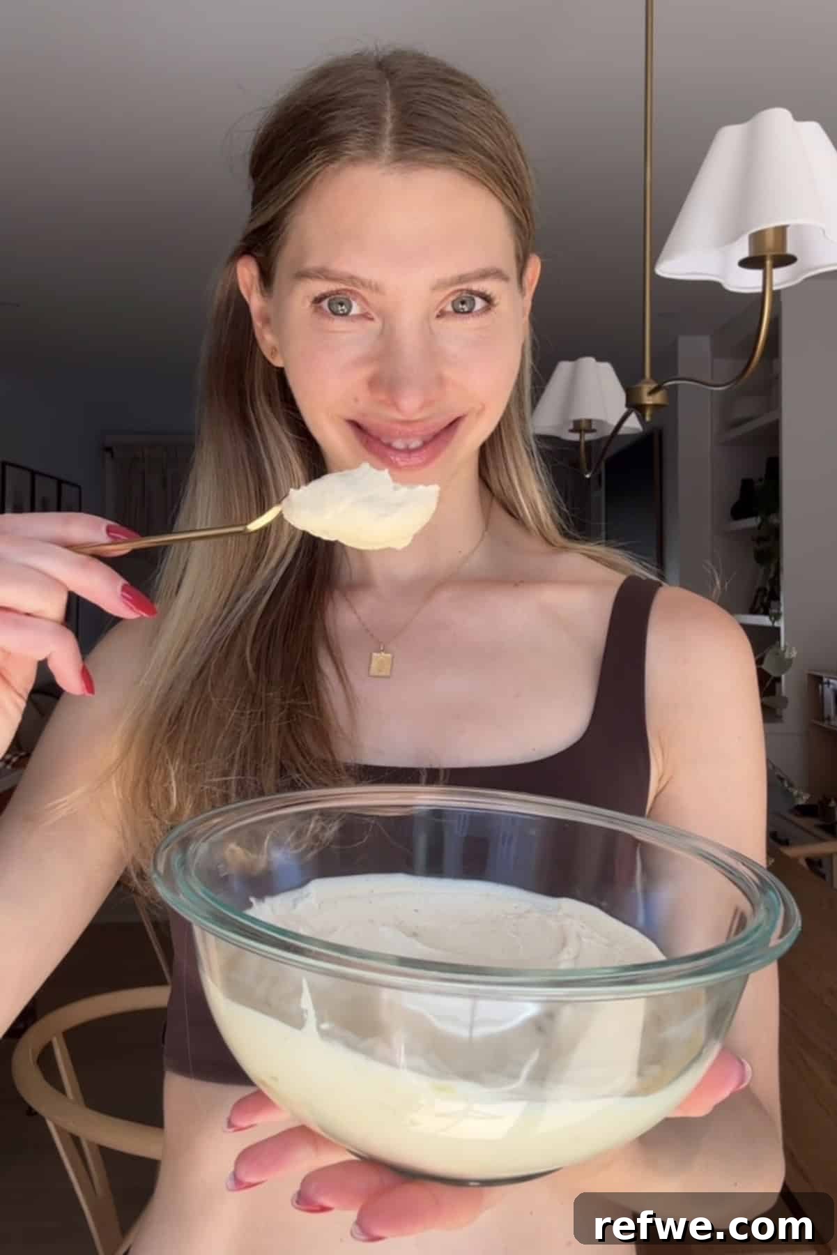 Creamy Greek Yogurt Peanut Butter Mousse Recipe 3 Jess holding a bowl of peanut butter mousse.